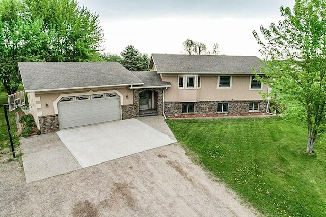 31528 63rd St, Royalton, MN 56373 - split level home featuring an attached garage, driveway, a front yard, and stucco siding
