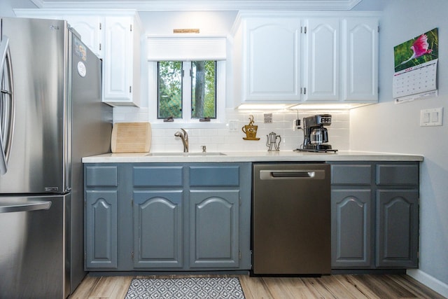 30202 Shady Ln, Detroit Lakes, MN 56501 - kitchen with appliances with stainless steel finishes, a sink, and light wood-type flooring