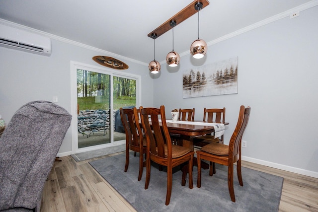 30202 Shady Ln, Detroit Lakes, MN 56501 - dining space with a wall mounted AC, ornamental molding, wood finished floors, and baseboards