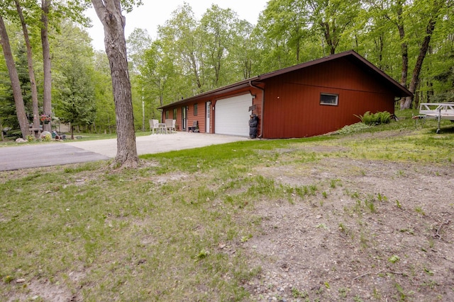 30202 Shady Ln, Detroit Lakes, MN 56501 - view of side of property featuring driveway and an outbuilding