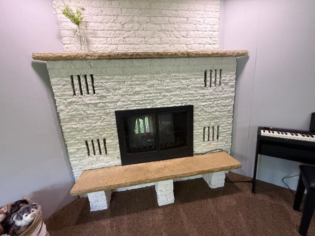 725 8th St NE, Staples, MN 56479 - detailed view of a stone fireplace and carpet flooring