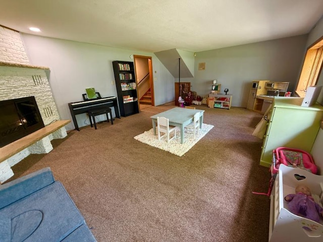 725 8th St NE, Staples, MN 56479 - living area featuring a stone fireplace, stairway, and carpet