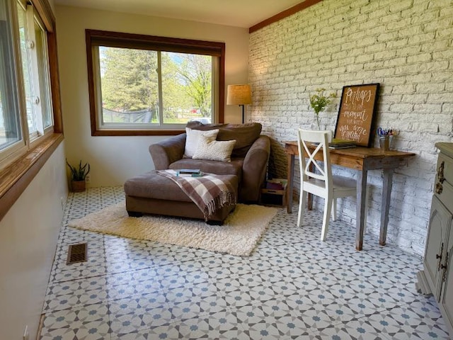 725 8th St NE, Staples, MN 56479 - living area with tile patterned floors and brick wall