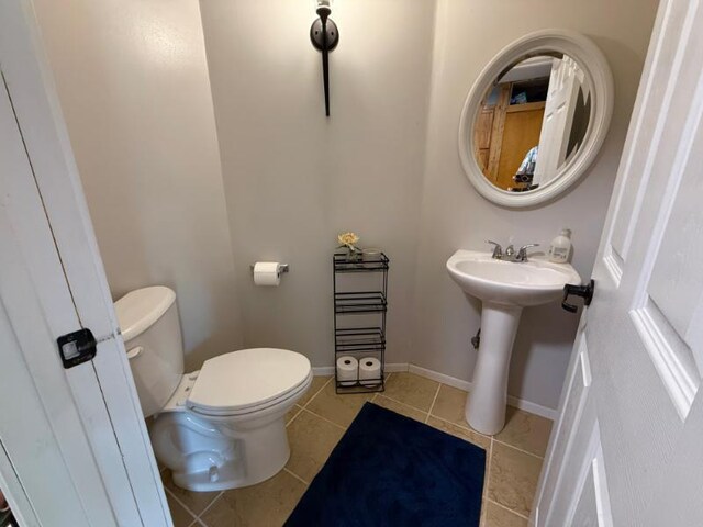 725 8th St NE, Staples, MN 56479 - half bath featuring tile patterned flooring and toilet