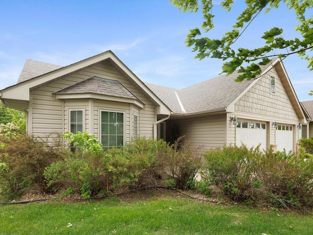 1232 Cypress Dr W, Annandale, MN 55302 - ranch-style house with a shingled roof and an attached garage