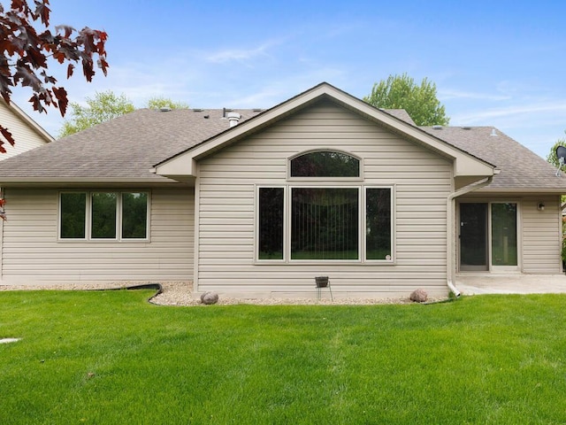 1232 Cypress Dr W, Annandale, MN 55302 - rear view of property with a lawn, a shingled roof, and a patio area