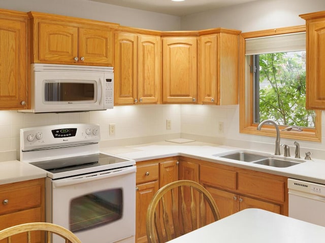 1232 Cypress Dr W, Annandale, MN 55302 - kitchen with white appliances, a sink, light countertops, and decorative backsplash