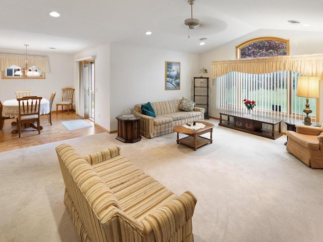 1232 Cypress Dr W, Annandale, MN 55302 - carpeted living room featuring lofted ceiling, ceiling fan, a chandelier, and recessed lighting