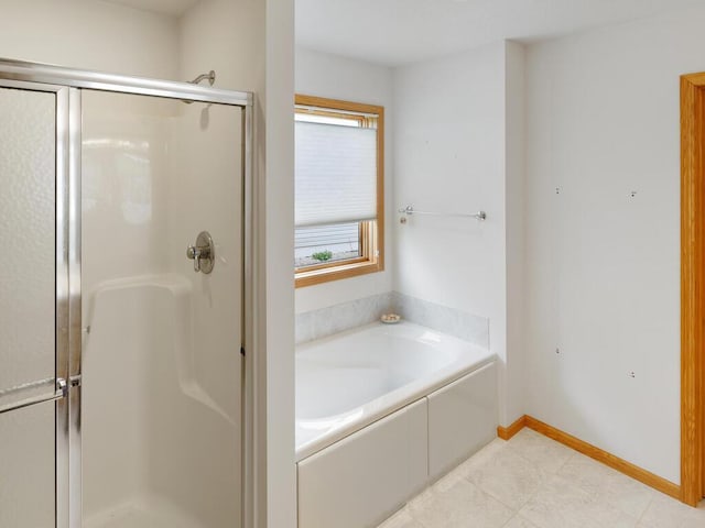 1232 Cypress Dr W, Annandale, MN 55302 - full bathroom featuring a shower stall, a garden tub, and baseboards