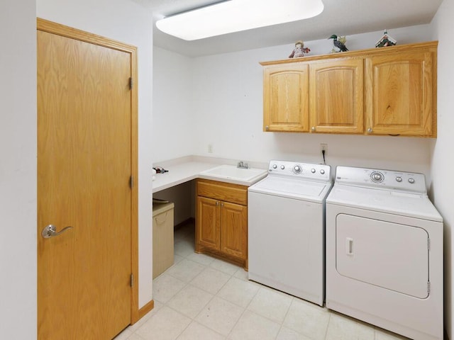 1232 Cypress Dr W, Annandale, MN 55302 - laundry area featuring cabinet space, washing machine and dryer, and light tile patterned flooring