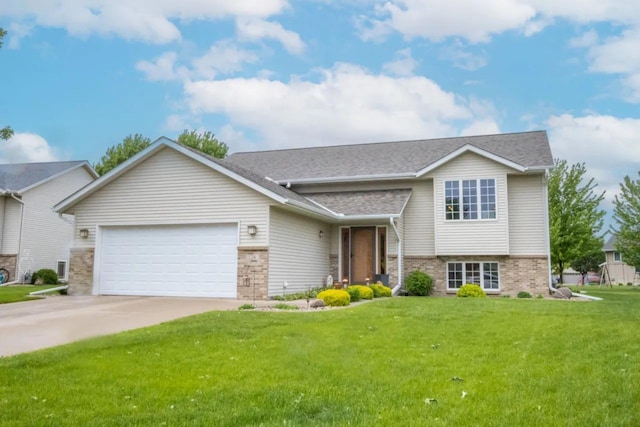 124 Waynesborough Way, Mankato, MN 56001 - tri-level home featuring brick siding, an attached garage, a front lawn, driveway, and a shingled roof