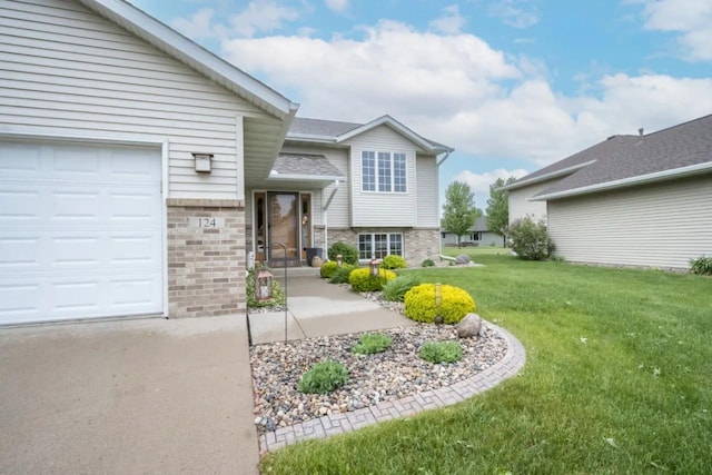 124 Waynesborough Way, Mankato, MN 56001 - view of front of property featuring brick siding, an attached garage, and a front yard
