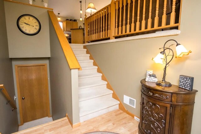 124 Waynesborough Way, Mankato, MN 56001 - stairs with wood finished floors and baseboards