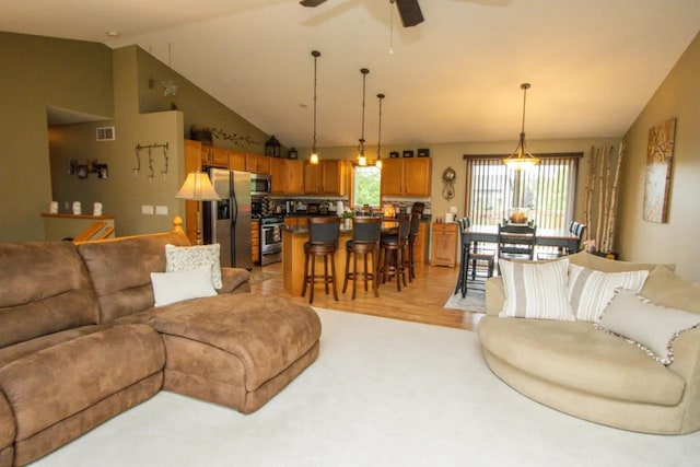 124 Waynesborough Way, Mankato, MN 56001 - living area with lofted ceiling, a ceiling fan, and light wood-style flooring