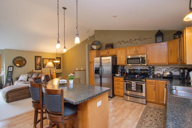 124 Waynesborough Way, Mankato, MN 56001 - kitchen with stainless steel appliances, light wood-style flooring, open floor plan, lofted ceiling, and tasteful backsplash