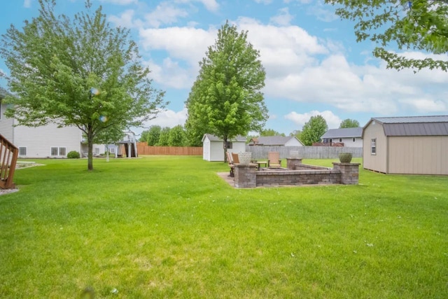 124 Waynesborough Way, Mankato, MN 56001 - view of yard featuring a storage unit and an outbuilding