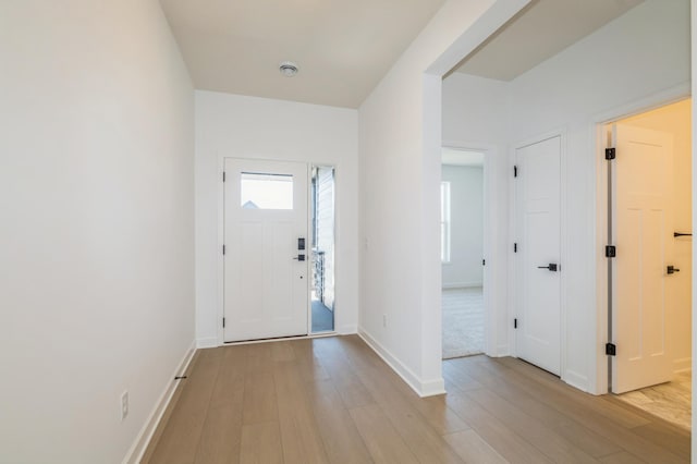 11454 Fieldstone Dr, Rogers, MN 55311 - foyer entrance featuring light wood finished floors and baseboards