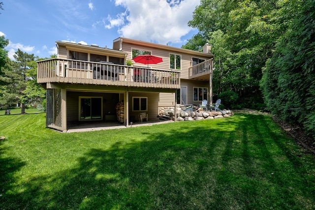 9378 Olympia Dr, Eden Prairie, MN 55347 - back of property featuring a patio area, a chimney, an outdoor fire pit, a lawn, and a wooden deck