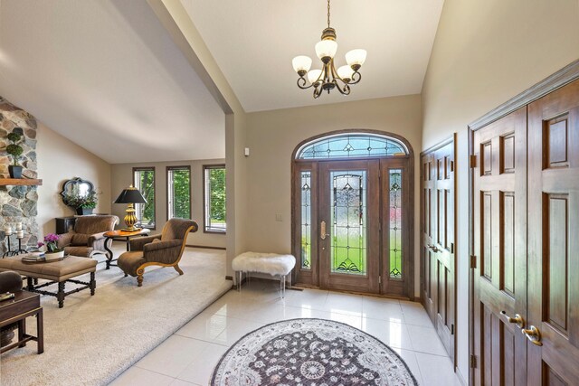 9378 Olympia Dr, Eden Prairie, MN 55347 - entrance foyer featuring a chandelier, light tile patterned flooring, and high vaulted ceiling