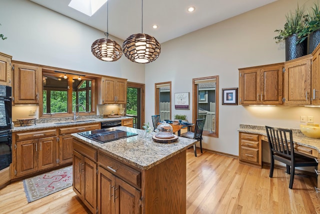 9378 Olympia Dr, Eden Prairie, MN 55347 - kitchen featuring high vaulted ceiling, a skylight, brown cabinets, a center island, and recessed lighting