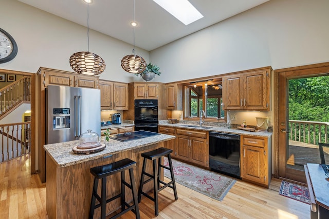 9378 Olympia Dr, Eden Prairie, MN 55347 - kitchen with black appliances, high vaulted ceiling, brown cabinets, and light wood-type flooring