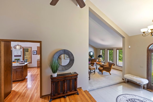 9378 Olympia Dr, Eden Prairie, MN 55347 - foyer entrance with a chandelier, light wood-style flooring, and ceiling fan