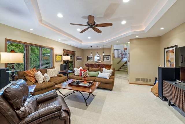 9378 Olympia Dr, Eden Prairie, MN 55347 - living room with a raised ceiling, stairway, light carpet, a ceiling fan, and recessed lighting