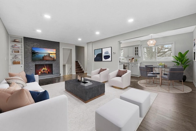 3633 Robinwood Ter, Minnetonka, MN 55305 - living area featuring recessed lighting, a brick fireplace, wood finished floors, baseboards, and stairway