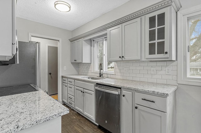 3633 Robinwood Ter, Minnetonka, MN 55305 - kitchen featuring stainless steel appliances, a sink, tasteful backsplash, healthy amount of natural light, and a textured ceiling