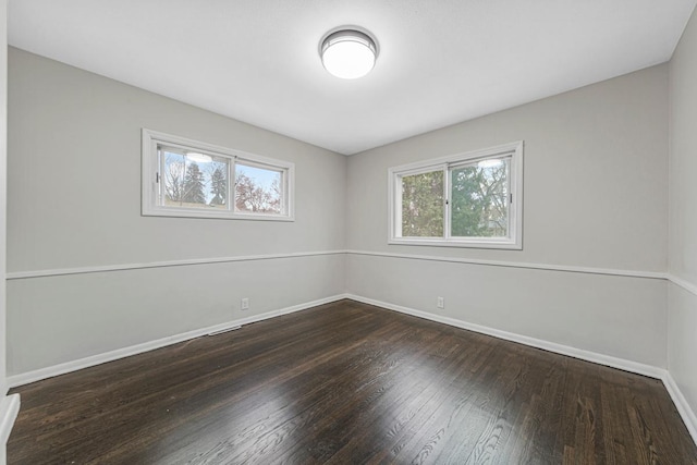 3633 Robinwood Ter, Minnetonka, MN 55305 - unfurnished room featuring plenty of natural light, baseboards, and hardwood / wood-style flooring