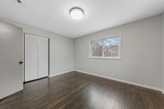 3633 Robinwood Ter, Minnetonka, MN 55305 - unfurnished bedroom featuring wood finished floors, baseboards, and a closet