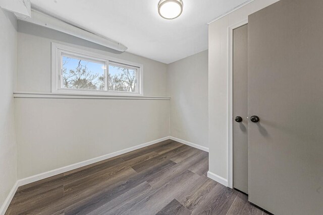 3633 Robinwood Ter, Minnetonka, MN 55305 - unfurnished room featuring dark wood-style flooring and baseboards