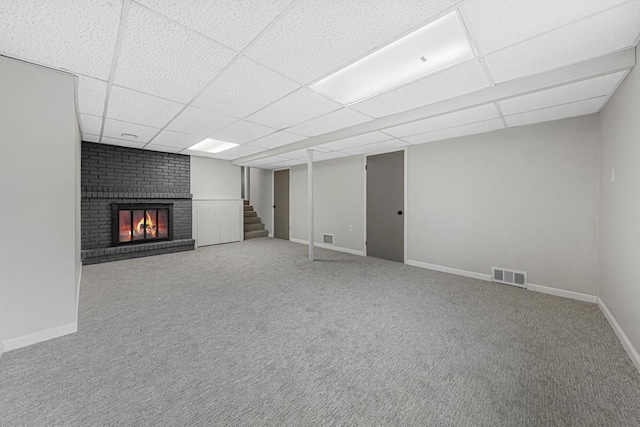 3633 Robinwood Ter, Minnetonka, MN 55305 - finished below grade area with a paneled ceiling, stairway, carpet flooring, a brick fireplace, and baseboards
