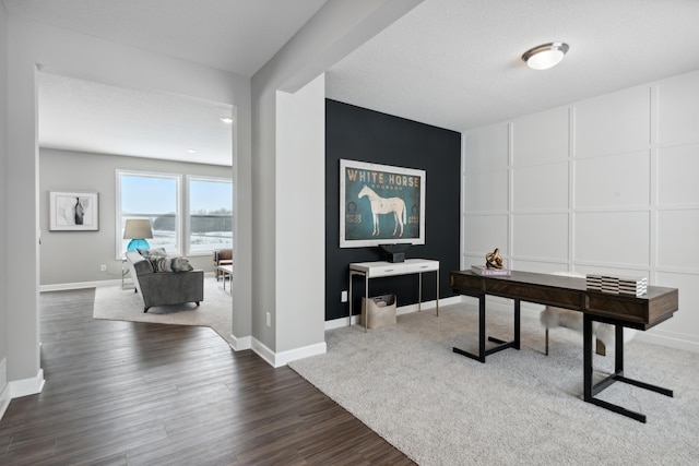 7581 Norway Ln, Lino Lakes, MN 55038 - office space featuring dark wood-type flooring, a decorative wall, and baseboards