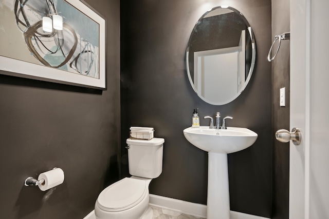 7581 Norway Ln, Lino Lakes, MN 55038 - half bathroom featuring toilet, marble finish floors, and baseboards