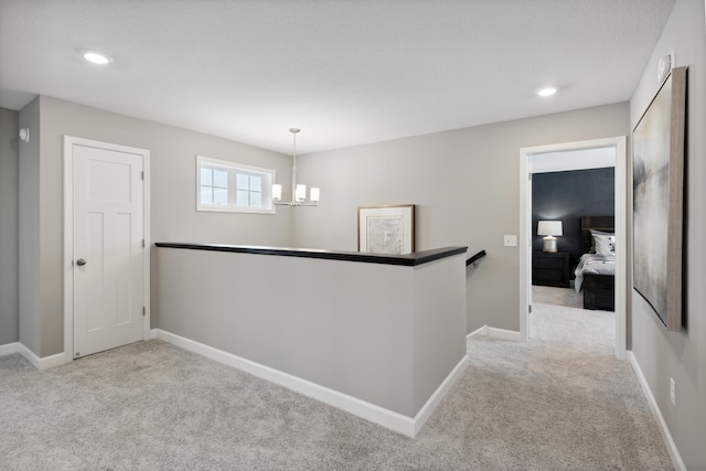 7581 Norway Ln, Lino Lakes, MN 55038 - hall featuring carpet, an upstairs landing, a chandelier, baseboards, and recessed lighting
