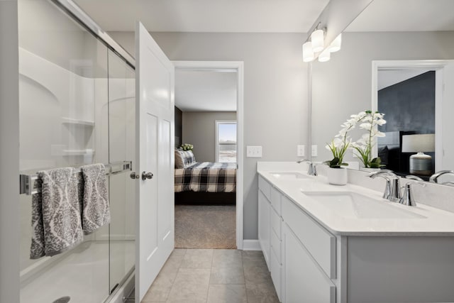 7581 Norway Ln, Lino Lakes, MN 55038 - ensuite bathroom with a stall shower, double vanity, tile patterned flooring, and baseboards