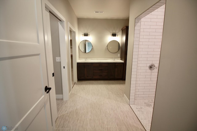 full bath with walk in shower and double vanity