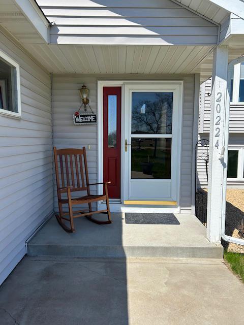 doorway to property with a porch