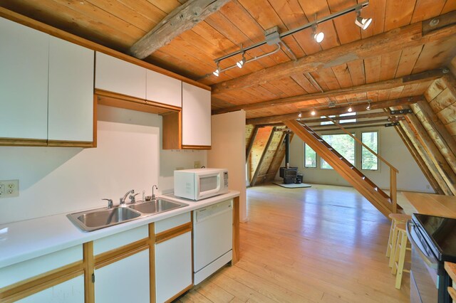 28435 392nd St, Browerville, MN 56438 - kitchen featuring white appliances, track lighting, wooden ceiling, a sink, and light countertops