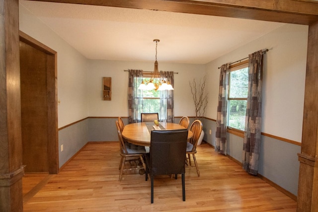 196 Mary Cir, North Mankato, MN 56003 - dining space with light wood finished floors and a chandelier