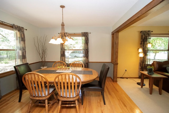 196 Mary Cir, North Mankato, MN 56003 - dining space featuring a chandelier, healthy amount of natural light, and light wood-type flooring