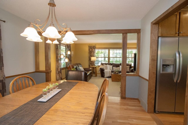196 Mary Cir, North Mankato, MN 56003 - dining room featuring a chandelier and light wood finished floors