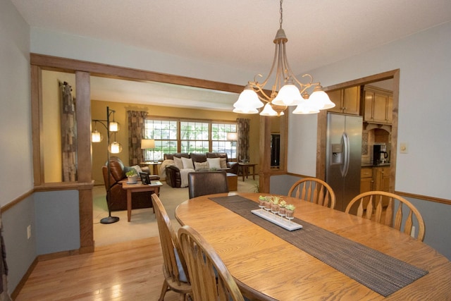 196 Mary Cir, North Mankato, MN 56003 - dining space featuring a chandelier, light wood-type flooring, and baseboards