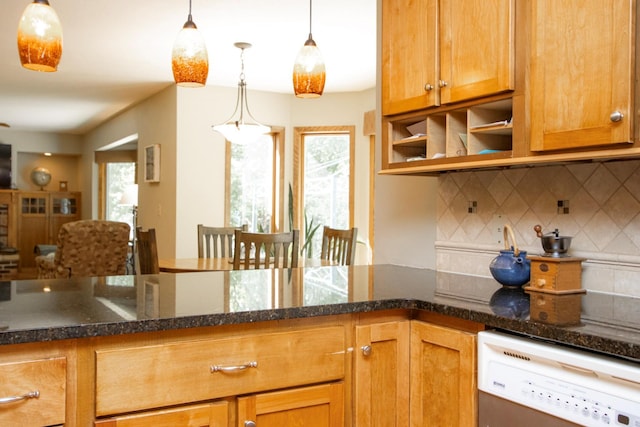 196 Mary Cir, North Mankato, MN 56003 - kitchen featuring white dishwasher, backsplash, dark stone counters, and decorative light fixtures