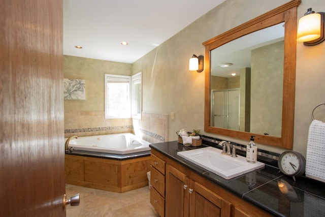 196 Mary Cir, North Mankato, MN 56003 - bathroom featuring vanity, a garden tub, a stall shower, tile patterned flooring, and recessed lighting