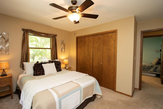 196 Mary Cir, North Mankato, MN 56003 - bedroom featuring light carpet, a closet, baseboards, and ceiling fan