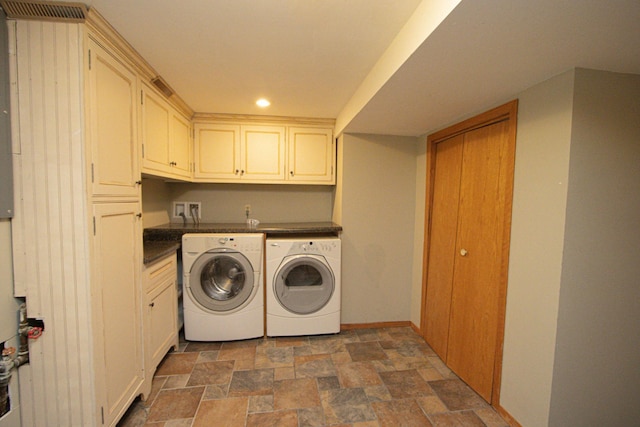 196 Mary Cir, North Mankato, MN 56003 - laundry area featuring washing machine and clothes dryer, cabinet space, stone finish flooring, recessed lighting, and baseboards
