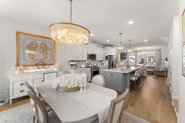 870 Mount Curve Blvd Unit F, Saint Paul, MN 55116 - dining space featuring a chandelier, light wood finished floors, and recessed lighting