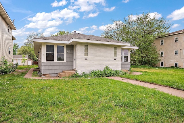 4625 Lyndale Ave N, Minneapolis, MN 55412 - view of front of property featuring a front lawn and brick siding